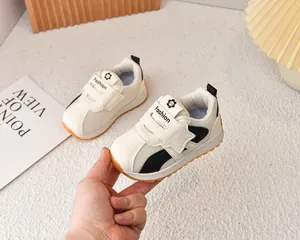 Detail view of breathable mesh kids sneakers with secure velcro strap and fashion logo