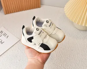 Detailed close-up of breathable mesh kids sneakers with non-slip gum sole and strap