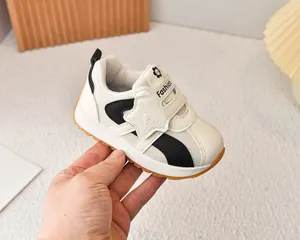 Detailed close-up of breathable mesh kids sneaker with star Velcro and rubber sole