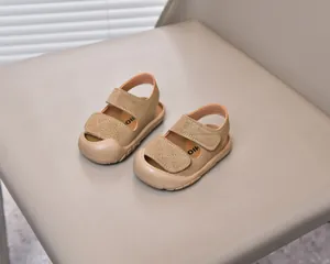 Close-up of baby sandals featuring a protective closed-toe design and velcro straps