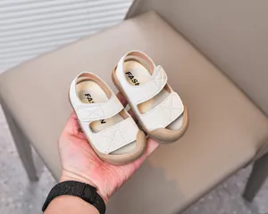 Detail of baby summer sandals with double Velcro straps and anti-collision rubber toe cap