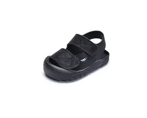 Close-up of black baby sandals featuring protective closed-toe and dual hook-and-loop straps