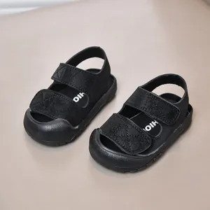 Minimalist black toddler sandals with anti-collision toe and non-slip rubber soles