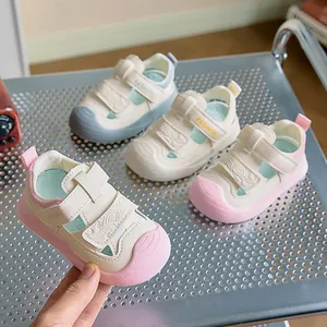 Detailed close-up of pink toddler sandals featuring durable double Velcro and toe protection