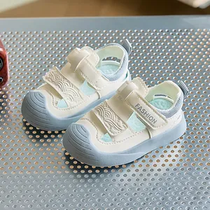 Detail view of baby sandals showing reinforced toe cap and secure velcro strap