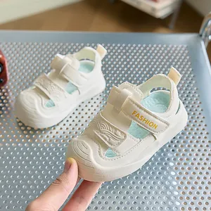 Detail of baby summer sandals featuring velcro straps and protective toe caps