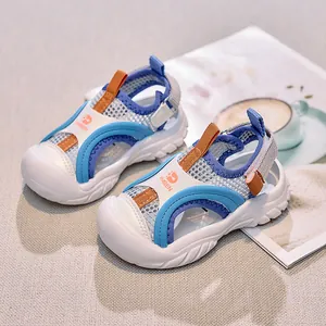 Detail view of breathable mesh and anti-collision toe cap on blue children sandals
