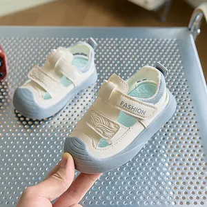 Detail of toddler sandals with anti-collision rubber toe cap and hook and loop closure