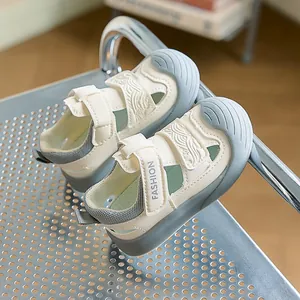 Detailed close-up of a baby closed-toe sandal featuring soft rubber sole and velcro closure