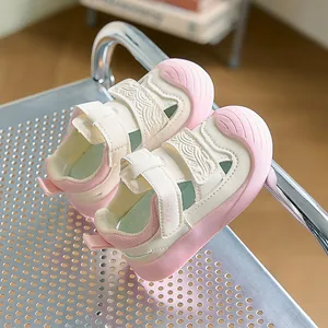 Detailed macro view of pink breathable mesh sandals with protective rubber toe cap and straps