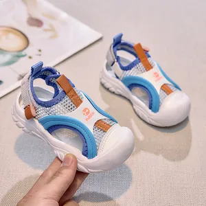 Detail view of breathable mesh and thick rubber sole on children outdoor sports sandals