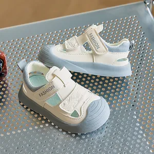 Detail of baby summer sandals with breathable mesh and dual velcro straps on metal rack