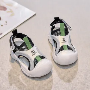 Close-up of kids breathable mesh sandals with protective toe cap and green accents