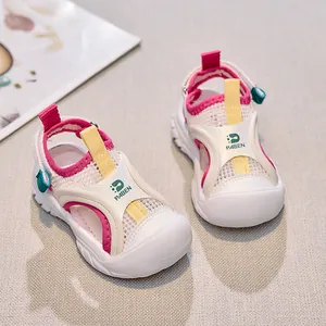 Detail view of breathable white mesh children's sandals with pink lining and anti-slip thick soles