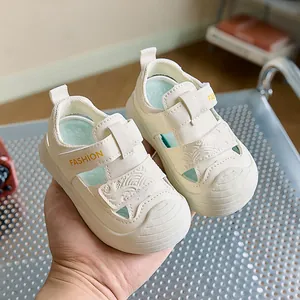 Close-up of baby sandals with hook-and-loop strap and wave texture detail