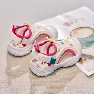 Detail of kids breathable mesh summer sandals with pink accents and velcro strap