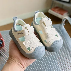 Close-up of infant breathable hollow-out sandals with anti-slip thick soles and velcro