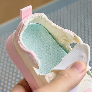 Close-up of breathable mesh insole and soft padded heel of pink baby walking sandals