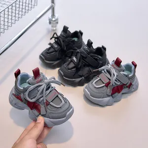 Detail view of kids' chunky sneakers featuring durable leather surface and wavy non-slip sole
