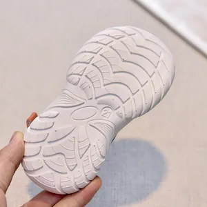 Close-up of size 21 toddler sandal sole featuring non-slip wavy rubber traction pattern