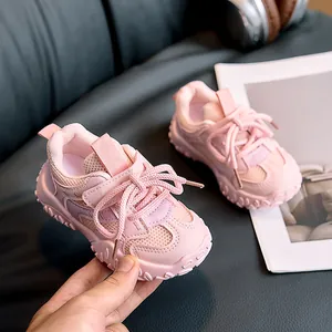 Detailed view of pink breathable mesh kids sneakers with convenient velcro straps