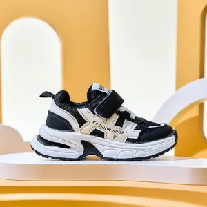 Detail of children sneakers with breathable mesh, hook-and-loop strap, and fashion sport text