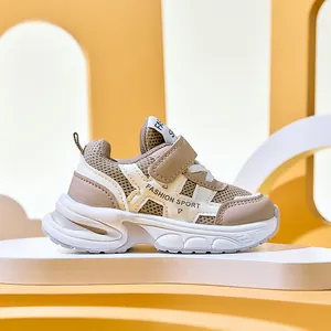 Detail view of breathable mesh and adjustable velcro strap on kids' sporty sneakers