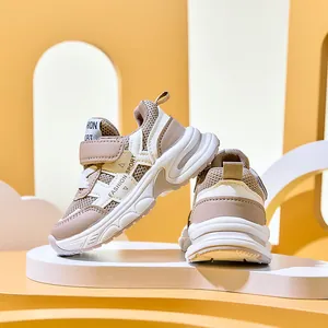Detailed side view of breathable mesh kids sneakers with velcro straps and fashion sport text