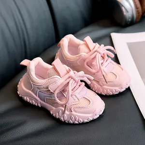 Detail of pink kids sneakers showing breathable mesh upper and durable non-slip rubber sole