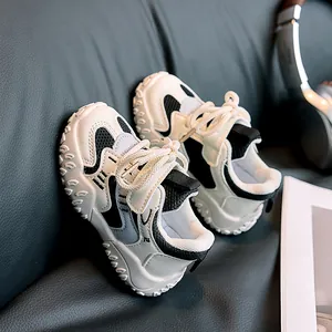 Detail of kids sneakers with hook-and-loop straps and thick non-slip rubber soles