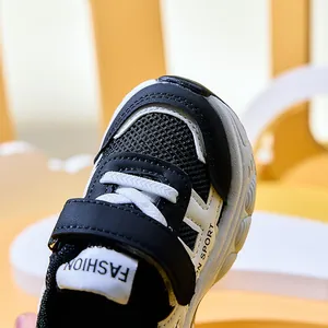 Detail of breathable mesh toe and velcro strap on children's lightweight sneakers