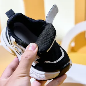 Detail of children's breathable mesh sneakers with velcro strap and anti-slip thick sole