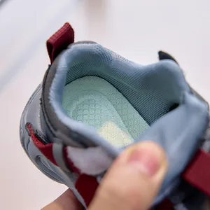 Detail of breathable mesh lining and non-slip honeycomb insole in kids sports shoes
