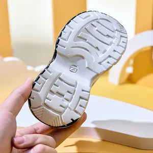 Detail view of anti-slip rubber shoe sole with size 23 engraving for kids sports sneakers