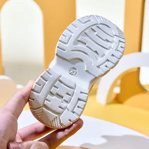 Close-up of lightweight non-slip white EVA sole with size 23 engraving for kids shoes