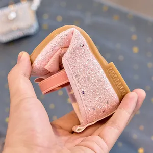 Detail showing the flexible soft rubber sole of these pink sequin princess shoes