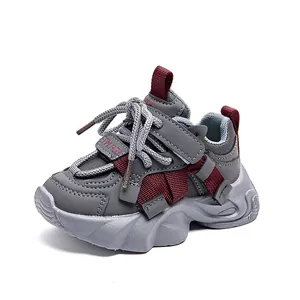 Detail view of children's sneakers with durable leather upper and non-slip thick sole