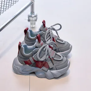 Detail of children sneakers showing wave-pattern anti-slip sole and breathable mesh