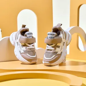 Detailed macro view of kids' sports shoes featuring breathable mesh and velcro straps