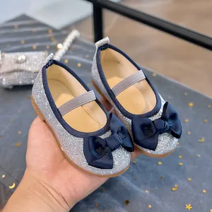 Sparkling silver sequin princess shoes for girls with dark blue bow and elastic strap