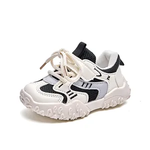 Kids breathable black and white sneakers with hook and loop strap and non-slip sole