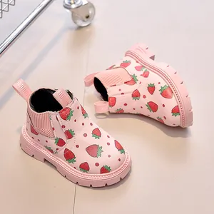 Pink kids boots featuring vibrant strawberry prints and non-slip rubber soles