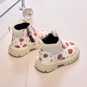 Detail of strawberry print boots with side zipper and thick anti-slip sole for toddlers