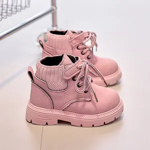 Detailed side view of pink suede children's boots with knit ankle and thick rubber soles