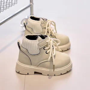 Detail of cream children boots with knitted cuff and durable non-slip rubber sole