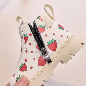 Detail of children's strawberry print boots with side zipper and thick non-slip soles