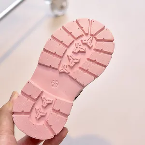 Detail of pink children's boot sole featuring deep anti-slip tread and size 23 mark