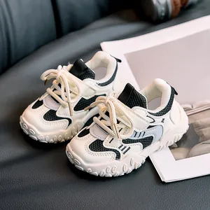 Kids black and white patchwork sneakers with mesh breathable fabric and thick non-slip soles