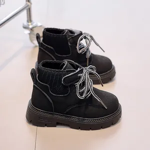 Detail of children's black Martin boots with knit collar and non-slip rubber sole