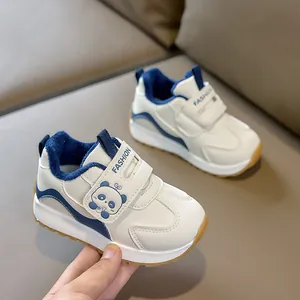 Close-up of warm navy fleece lining and convenient velcro strap on toddler sport shoes